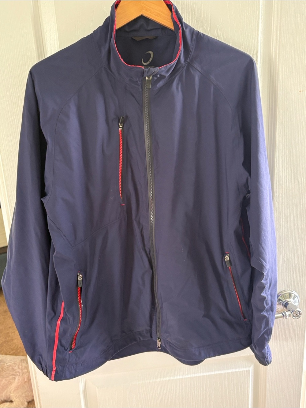 Navy Blue Zero Restriction Gore-Tex Stealth Jacket with red trim.